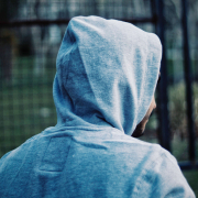 man wearing a grey hooded top